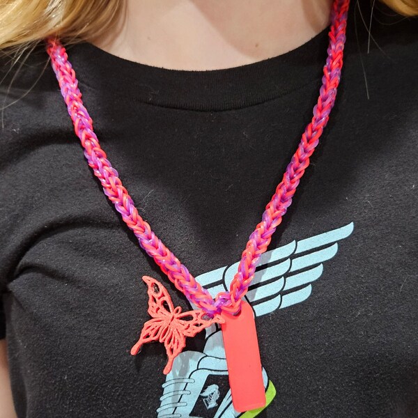 Rubber band necklaces with 3d printed working whistles and charms