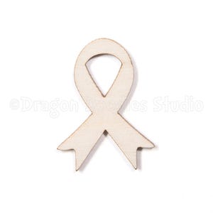 May include: A wooden cutout of a white ribbon, a symbol of support and awareness.