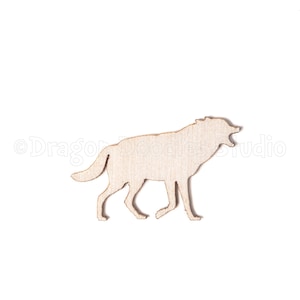 May include: A wooden cutout of a wolf in a howling pose. The wolf is depicted in profile, with its mouth open and head raised. The cutout is made of light-colored wood and is set against a white background.