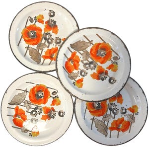 May include: A set of four round ceramic plates featuring a white base with a hand-painted floral pattern of bright orange poppies, dark grey stems, and muted brown leaves. Each plate has a dark, speckled rim with a distressed, textured edge.