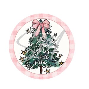May include: A round Christmas-themed design featuring a watercolor Christmas tree with a pink bow and the text "Oh Come Let Us Adore Him." The design is surrounded by a pink and white gingham border and star accents.