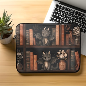 May include: Laptop sleeve featuring a whimsical illustration of a bookshelf with books, vases, and two cartoon dragons. The dragons have wings and are sitting on the shelves. The background is dark, and the overall color scheme is brown and black.
