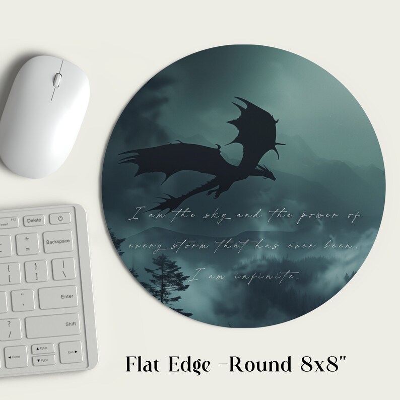 May include: A round mousepad with a dark green and blue background featuring a silhouette of a dragon flying over a mountain range. The text "I am the sky and the power of every storm that has ever been. I am infinite." is printed on the mousepad. The mousepad is 8 inches in diameter.