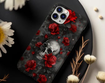 Könnte beinhalten: Eine schwarze Handyhülle mit einem Totenkopf- und roten Rosen-Design. Die Hülle hat einen Kameraausschnitt und einen weißen Totenkopf vor schwarzem Hintergrund.