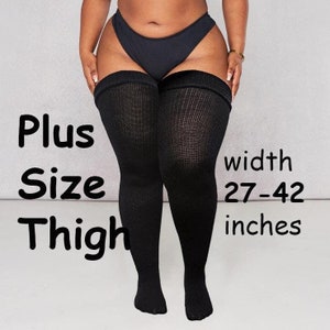May include: Black thigh-high stockings with a ribbed texture. The stockings are designed for larger thighs, with a width of 27-42 inches.