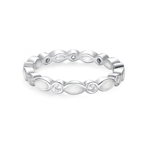 May include: A silver-colored ring with a repeating pattern of oval-shaped white inlays and round clear stones. The ring is designed with a continuous band of alternating shapes and stones, creating a delicate and elegant look. The ring is a piece of jewelry.