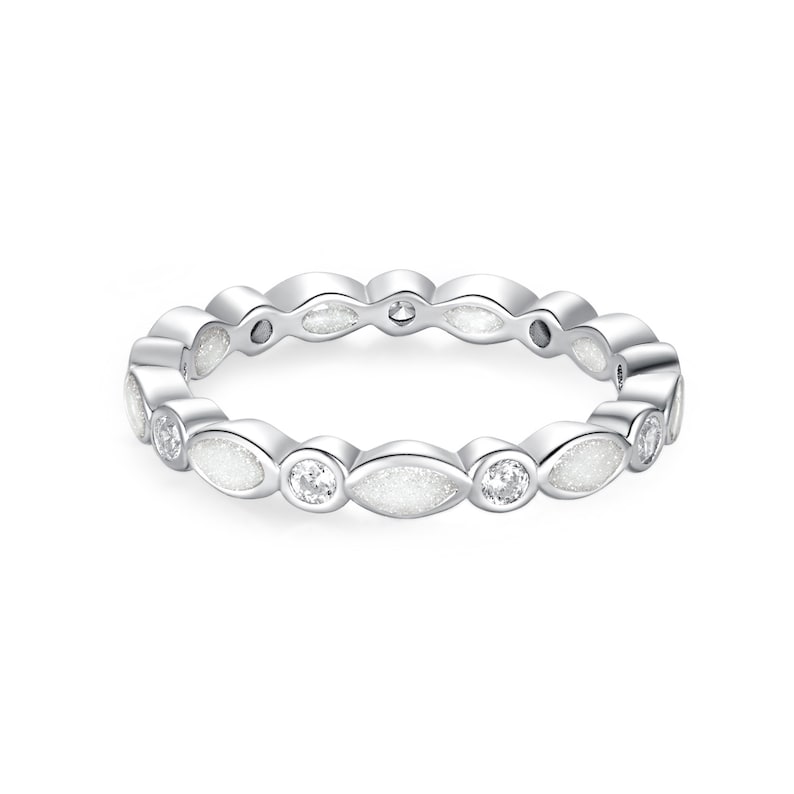 May include: A silver-colored ring with a repeating pattern of oval-shaped white inlays and round clear stones. The ring is designed with a continuous band of alternating shapes and stones, creating a delicate and elegant look. The ring is a piece of jewelry.