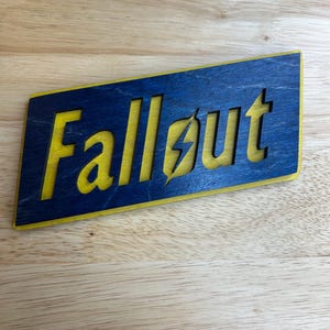 Hand-Painted Fallout Logo Sign: Video Game Inspired Wooden Decor