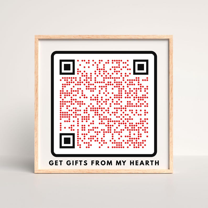 May include: A framed print featuring a QR code composed of red dots on a white background. The QR code is surrounded by a black border. Below the code, the text "GET GIFTS FROM MY HEARTH" is printed in black.