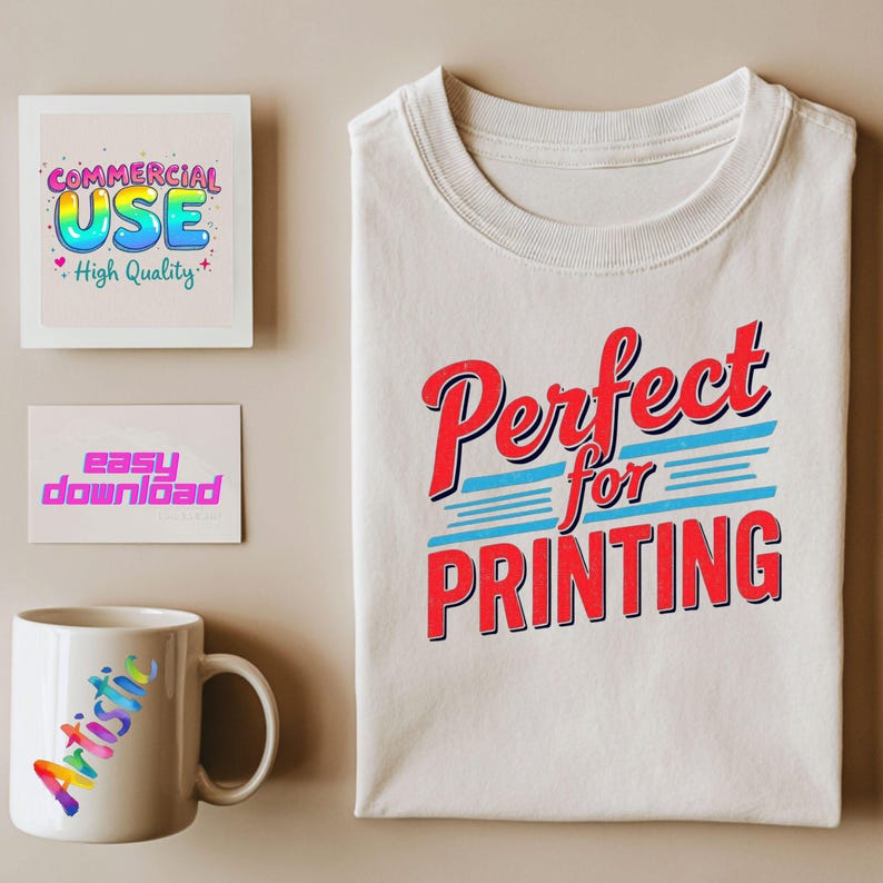 May include: A folded white t-shirt with the text "Perfect for Printing" in red and blue. A white mug with the word "Artistic" in rainbow colors. Two cards with the text "Commercial Use" and "Easy Download".