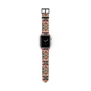 Op de afbeelding: Een zwarte Apple Watch met een kleurrijk geometrisch band. Het band heeft een mix van rode, oranje, blauwe en witte kleuren.