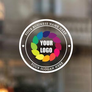 May include: A circular window decal featuring a white border with two stars on the sides. The text reads "YOUR BUSINESS NAME HERE" at the top and "YOUR SLOGAN HERE" at the bottom. In the center, a ring of multicolored leaf shapes surrounds the text "YOUR LOGO".