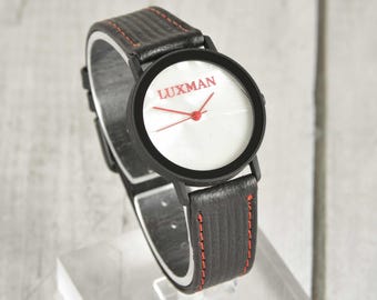 Luxman (high end audio?) branded watch. Black strap, Black case, Mother of Pearl Dial. Gift for an Audiophile?