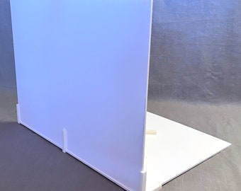 May include: White backdrop for product photography, made of foam board. It features a white background and a white base with a slight angle for a more dynamic look.