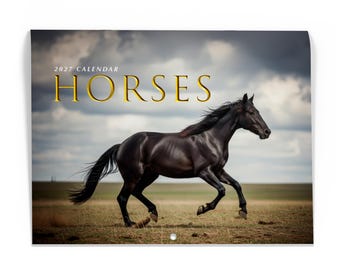 May include: A 2027 calendar featuring a black horse galloping across a field under a cloudy sky. The text 2027 CALENDAR HORSES is printed in gold lettering at the top. The horse is shown in profile, moving from left to right across the frame.