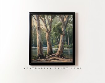 May include: A framed painting of a landscape with three trees in the foreground and a river in the background. The trees are tall and slender with light brown bark. The river is calm and still, reflecting the sky and trees. The painting is done in a realistic style with a muted color palette.