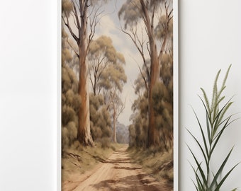 May include: A framed painting of a dirt road leading through a forest of tall, slender trees with brown bark and green leaves. The sky is a light blue with some clouds. The painting is in a white frame.