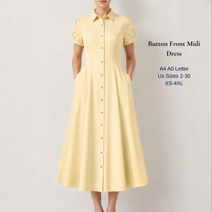 May include: A pale yellow midi dress with a button-front design, short sleeves, and a collared neckline. The dress has pockets and a flared skirt. Text on the right side reads "Button Front Midi Dress" and size information.