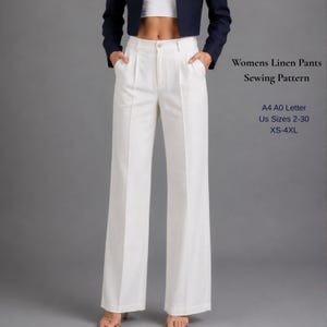 May include: White linen pants with a wide leg design. The pants have a high waist and pockets. The image also includes text that reads "Womens Linen Pants Sewing Pattern" and "US Sizes 2-30 XS-4XL".
