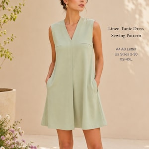Può includere: Un abito tunica senza maniche in lino verde salvia con scollo a V e tasche laterali. Il testo recita: Linen Tunic Dress Sewing Pattern, A4 A0 Letter, Us Sizes 2-30, XS-4XL. Il capo presenta una silhouette dritta e un design pulito.