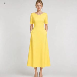 May include: A bright yellow midi dress featuring a V-neckline, short sleeves, and a fitted bodice that transitions into a flared A-line skirt. The dress includes two side pockets integrated into the seams and falls to a mid-calf length.