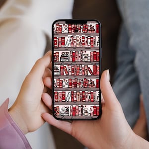 May include: A smartphone displaying a digital wallpaper featuring a bookshelf design. The wallpaper showcases rows of books in shades of red and pink, with decorative elements like hearts and teddy bears. The time 5:59 is displayed at the top.