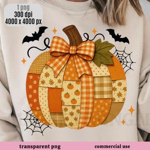 May include: A graphic design of a pumpkin featuring a patchwork pattern of orange, yellow, and white floral, gingham, and polka dot prints. The pumpkin is topped with a plaid bow and a green leaf, surrounded by black bats, spiderwebs, and stars.