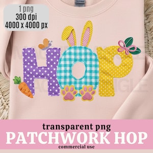 Pu&ograve; includere: Felpa rosa chiaro con un design patchwork che recita "HOP". La "H" &egrave; viola a pois bianchi, la "O" &egrave; a scacchi blu e bianchi e la "P" &egrave; gialla a pois bianchi. Include una carota, una farfalla e impronte di zampe.