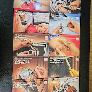 May include: A set of nine illustrated guides for home and car maintenance and emergency situations. Each guide features a different topic, such as home security, car maintenance, first aid, and plumbing. The guides are all in French and feature a yellow and red color scheme.