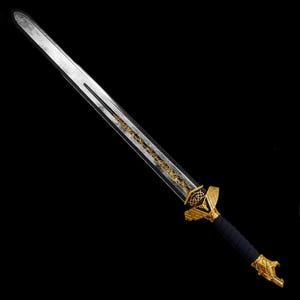 May include: A long sword featuring a silver-toned blade with a central fuller, a gold-colored crossguard with intricate filigree patterns, a black wrapped handle, and a gold-toned pommel shaped like a stylized animal head against a black background.