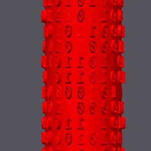 May include: A tall, red cylindrical object featuring a repeating pattern of symbols and numbers. The word "normal" is at the top. The object has a textured surface against a grey background.