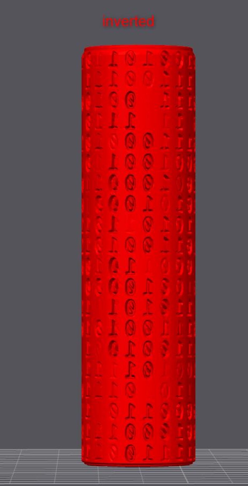 May include: A tall, cylindrical object in a vibrant red hue, covered in a repeating pattern of embossed symbols. The word "inverted" is written in red at the top. The background is grey.