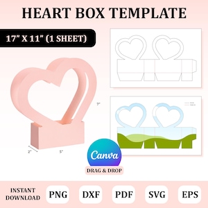Puede incluir: Plantilla de caja en forma de corazón rosa, 43 cm x 28 cm (1 hoja). El diseño incluye una base de 5 cm x 13 cm y una forma de corazón de 18 cm de alto. También se muestra el logotipo de Canva y las opciones de tipo de archivo.