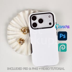 May include: A white phone case with a black border, next to a white seashell-shaped dish with two gold knot earrings. The image includes the text "Canva", "Ps", and "Included PSD & PNG + Video Tutorial".