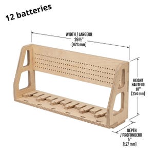 May include: A wooden battery organizer with a width of 26.5 inches, a height of 10 inches, and a depth of 5 inches. It has multiple slots and holes for storing batteries. The text "12 batteries" is visible.