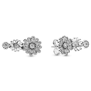 May include: A pair of silver earrings featuring a cluster of three daisy-shaped designs, each with a centre stone and smaller stones around the edges.