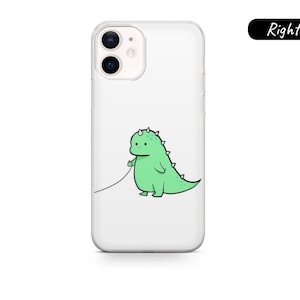 May include: Clear phone case with a cartoon green dinosaur design. The dinosaur is holding a leash. The phone case is for an iPhone.