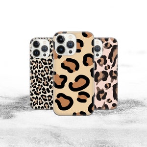 May include: Three iPhone cases featuring a leopard print design. The cases are in various shades of brown, black, and white.