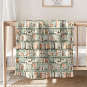 May include: A baby blanket with a watercolor design of a bookshelf filled with books and bouquets of flowers. The background is a light green wood paneling. The blanket is draped over a crib.