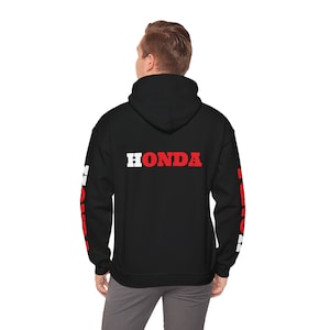 May include: Black hooded sweatshirt with red and white "HONDA" lettering on the back and red and white "HONDA" lettering on the sleeves.