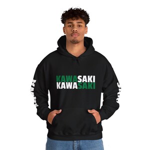 May include: Black hooded sweatshirt with white text that reads "KAWASAKI" twice, with the second word in green. The sleeves have white text that reads "KAWASAKI" vertically.