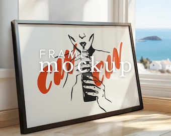 May include: Black framed poster with a white background and a red and black illustration of a person drinking from a bottle. The text "FRAME MOCKUP" is written in black on the poster.