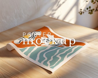 May include: A rolled up poster mockup with an abstract design featuring orange, yellow, blue, and white colors. The poster is on a wooden surface with the text "POSTER MOCKUP" printed on it.