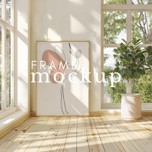 May include: A gold frame mockup with a white background and a line drawing of a crane with a pink and peach abstract shape behind it. The text "FRAME MOCKUP" is in the center of the image.