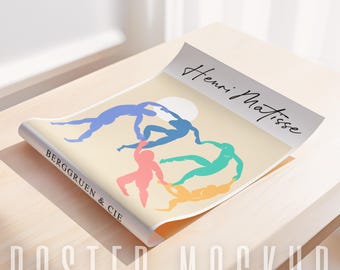 May include: A poster mockup featuring a colorful illustration of five figures dancing in a circle. The poster is titled "Henri Matisse" and has the text "Berggruen & Cie" at the bottom.
