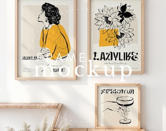 Puede incluir: Tres impresiones de arte enmarcadas en una pared blanca. La impresión de la izquierda presenta un dibujo en blanco y negro de una persona con una camisa amarilla. La impresión del medio presenta un dibujo en blanco y negro de flores con acentos amarillos. La impresión de la derecha presenta un dibujo en blanco y negro de una mano sosteniendo una copa de vino. El texto "LAZYLIKE" está impreso en la impresión del medio. El texto "FREEDOM" está impreso en la impresión de la derecha.