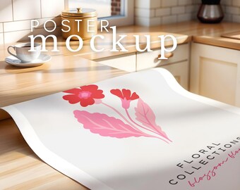 May include: A white poster mockup with a floral design featuring pink leaves and red flowers. The text "FLORAL COLLECTIONS blossom flow" is printed on the poster.