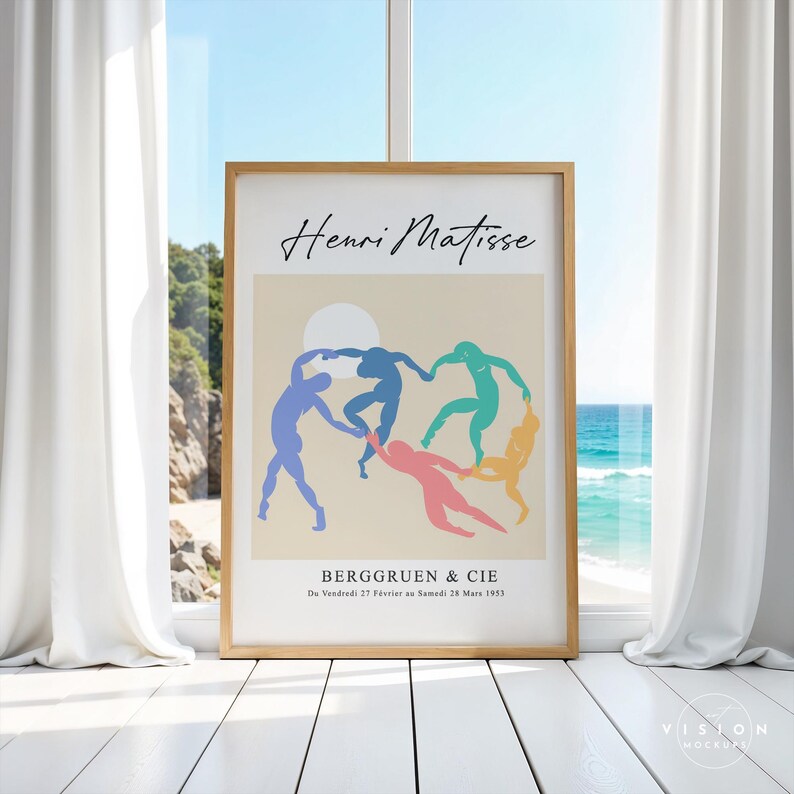 May include: A framed print of a painting by Henri Matisse titled "Dance (I)". The painting depicts five figures in a circle, dancing against a beige background. The figures are outlined in blue, green, pink, and yellow. The text "BERGGRUEN & CIE" and "Du Vendredi 27 F&eacute;vrier au Samedi 28 Mars 1953" is printed below the painting.