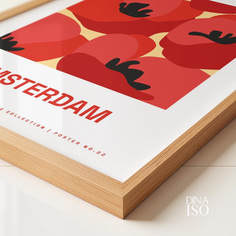 May include: A framed poster with a red, white, and black abstract design. The poster says "Amsterdam" and "E Collection | Poster No. 22".