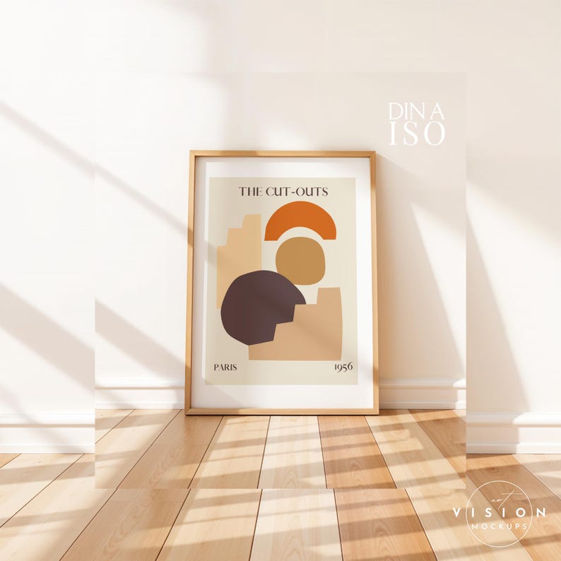 May include: A framed print with a minimalist abstract design in shades of brown, orange, and beige. The print is titled "The Cut-Outs" and includes the text "Paris 1956".